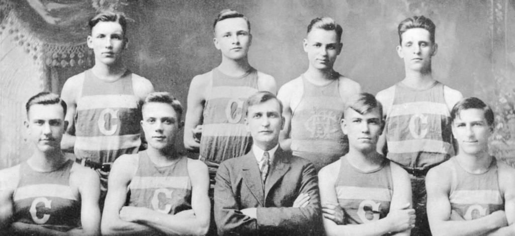 An image of basketball player and shoe designer Chuck Taylor with his basketball team.