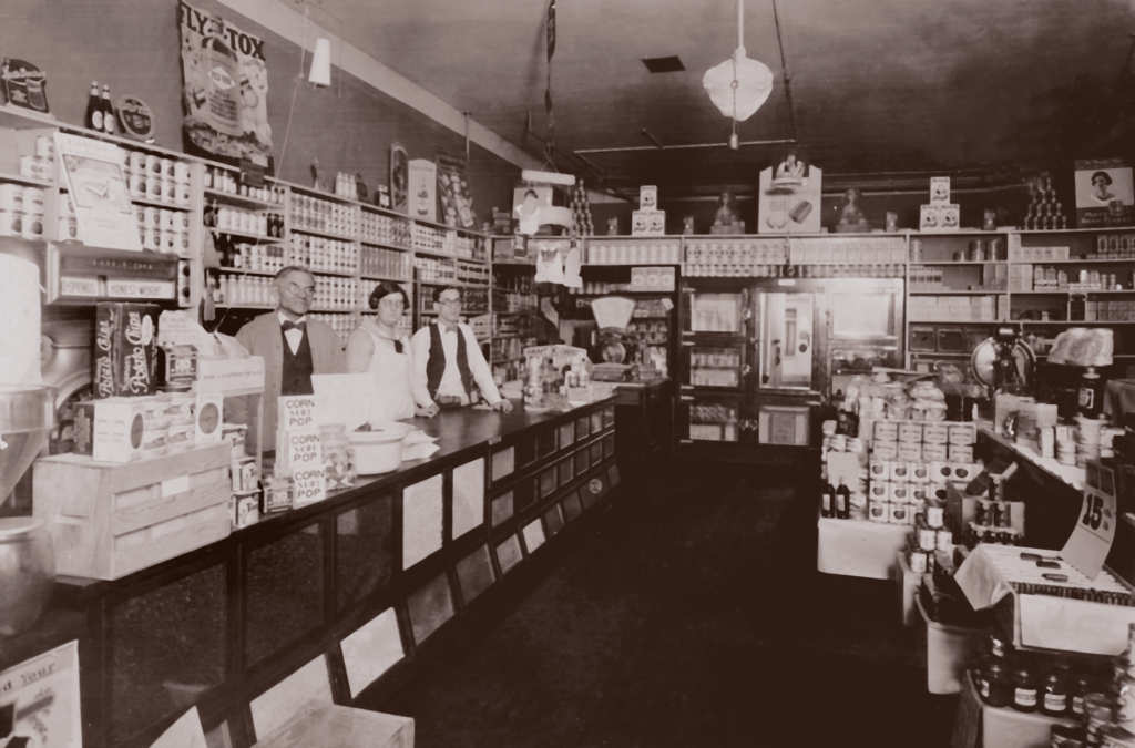 An image of Harry Kern, Tillie Cofield, and Russel Zeh in Kern's Grocery Store.