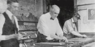 A photo of Warren G. Harding making a page for the press
