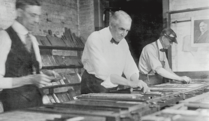 A photo of Warren G. Harding making a page for the press
