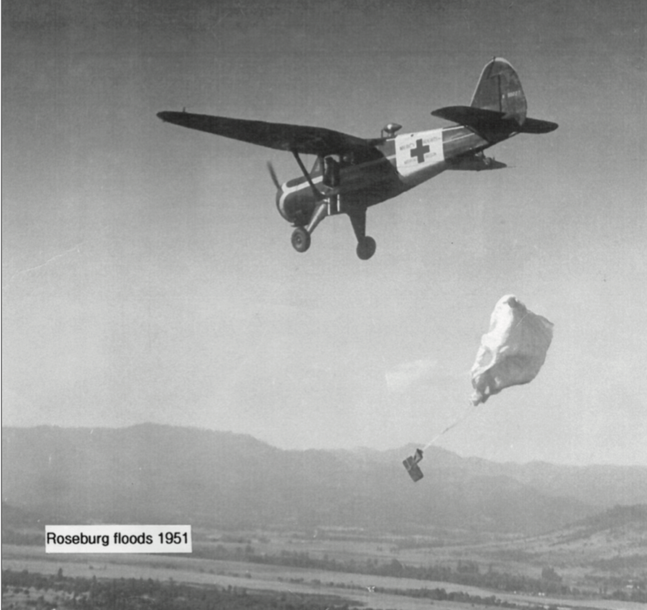 A Mercy Flight plane dropping off supplies mid-flight