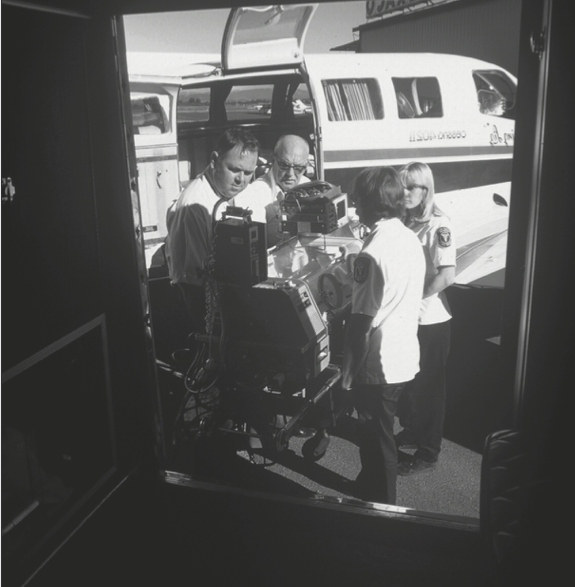 Mercy Flight crew transporting a child in a neo-natal unit