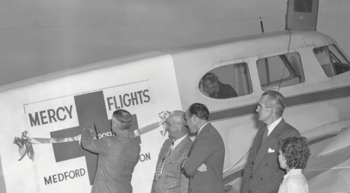 A ribbon-cutting ceremony honoring refurbishment of the first Mercy Flight Plane