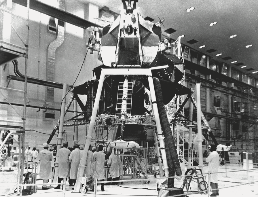 A group of scientists building a lunar module